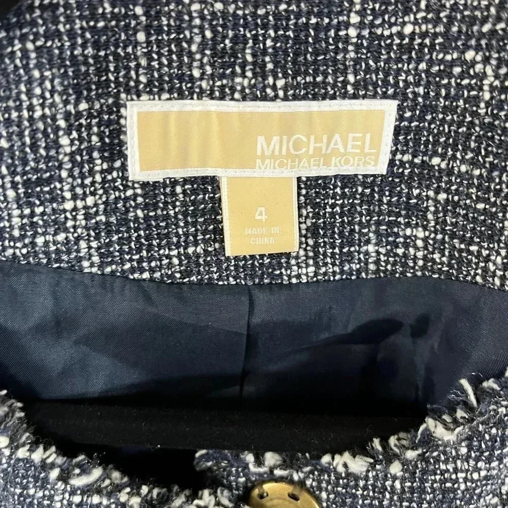 Michael Kors Jacket. Black and white with four button closures Ladies size 4